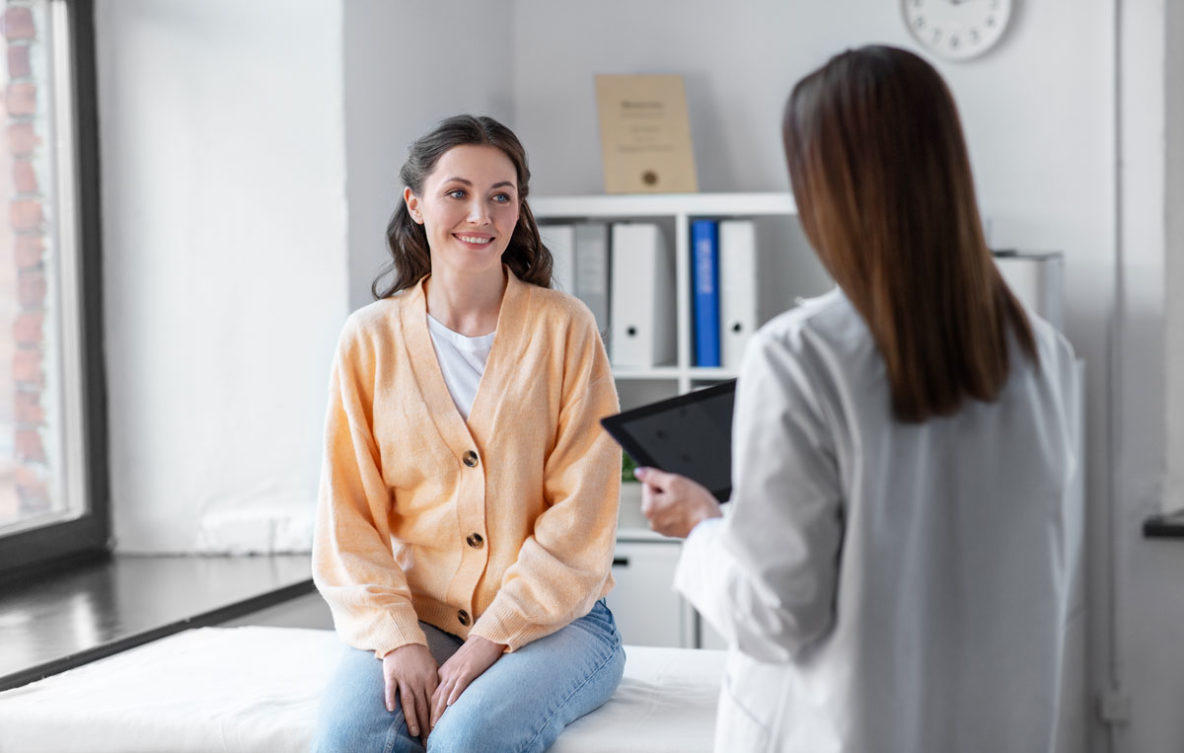 woman speaking with doctor